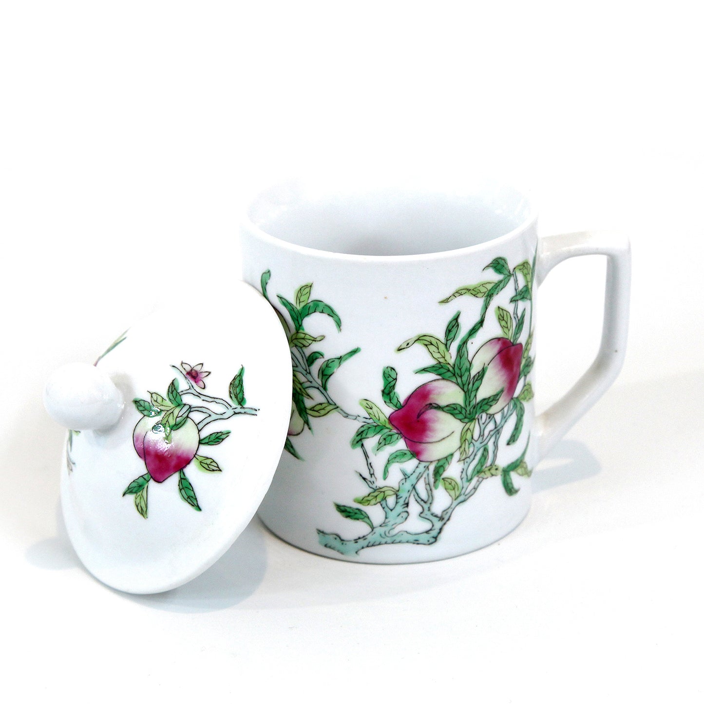 桃柄の蓋つきマグカップ